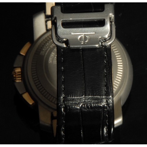 1283 - A Baume & Mercier 18ct gold and titanium Capeland S XL chronograph wristwatch, No 3574469, stainless... 