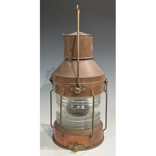 2446 - A copper and brass ship’s lantern, swing carry handle, 62cm high over handle