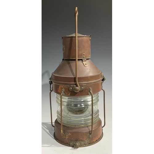 2446 - A copper and brass ship’s lantern, swing carry handle, 62cm high over handle