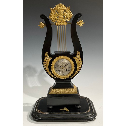 2404 - A Louis XVI Revival gilt metal mounted ebonised lyre-shaped table clock, 8.5cm silvered dial inscrib... 