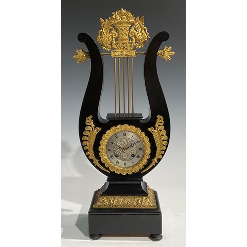 2404 - A Louis XVI Revival gilt metal mounted ebonised lyre-shaped table clock, 8.5cm silvered dial inscrib... 