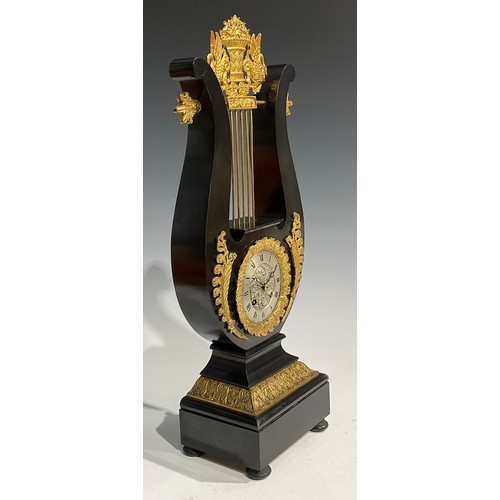 2404 - A Louis XVI Revival gilt metal mounted ebonised lyre-shaped table clock, 8.5cm silvered dial inscrib... 