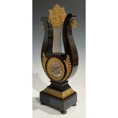 2404 - A Louis XVI Revival gilt metal mounted ebonised lyre-shaped table clock, 8.5cm silvered dial inscrib... 