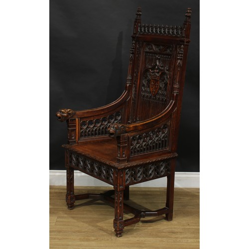 2058 - A late 19th century Gothic Revival throne-form chair, the back centred by a shield-shaped armorial, ... 