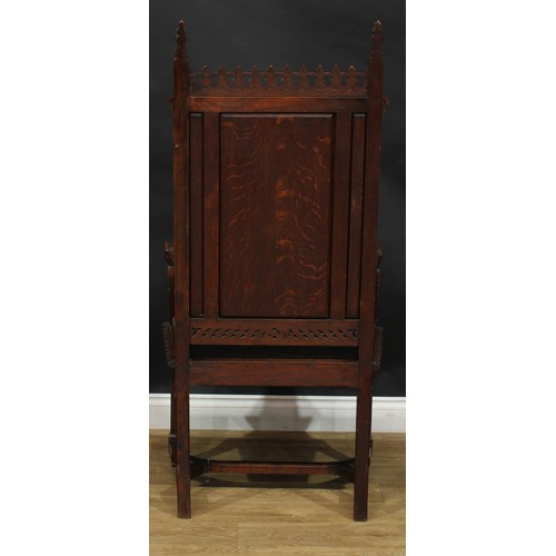 2058 - A late 19th century Gothic Revival throne-form chair, the back centred by a shield-shaped armorial, ... 