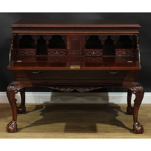 2105 - A George III mahogany secretaire chest on stand, in the manner of William Vile, later retailed by Mu... 