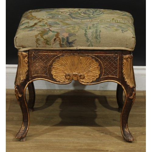 1971 - A pair of George II Revival parcel-gilt stools, stuffed-over upholstery, the frieze carved with a sh... 