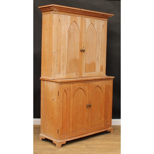 1837 - A late 19th/early 20th century pine housekeeper’s cupboard, moulded cornice above a pair of panel do... 