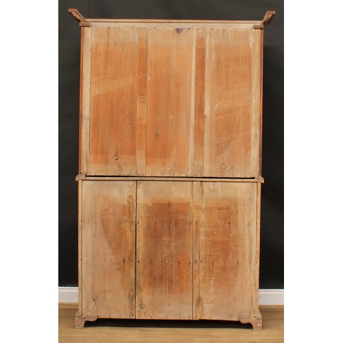 1837 - A late 19th/early 20th century pine housekeeper’s cupboard, moulded cornice above a pair of panel do... 