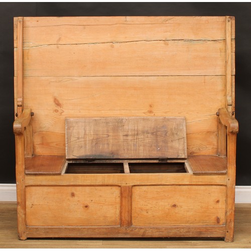 2674 - An early 20th century pine monk’s bench, hinged seat, 72.5cm opening to 127cm high, 136.5cm wide, 73... 