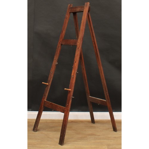 1912 - An early 20th century oak artist’s painting easel, 179cm high, 66.5cm wide at stretcher