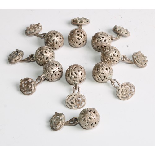 1057 - A set of nine Chinese silver coloured metal buttons, pierced, 4cm long overall, unmarked