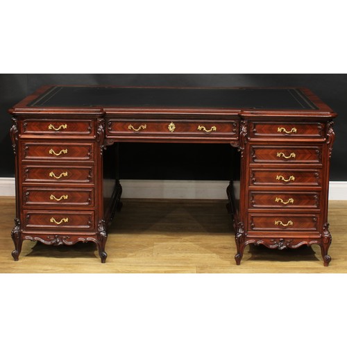 2057 - A late 19th century French rosewood and kingwood twin pedestal desk, inverted break-centre top with ... 