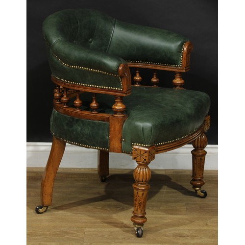 1956 - A late Victorian oak club or desk chair, stuffed-over green hide upholstery, studded borders, turned... 