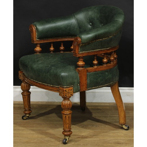 1956 - A late Victorian oak club or desk chair, stuffed-over green hide upholstery, studded borders, turned... 