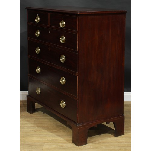 2051 - A George IV mahogany chest, rectangular top with moulded edge above two short and four long graduate... 