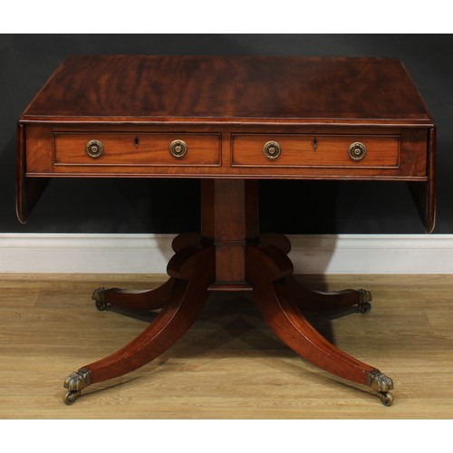 2231 - A Regency flame crossbanded mahogany sofa table, rounded rectangular top with fall leaves above a pa... 