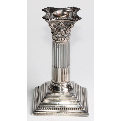 1035 - A pair of Victorian silver Corinthian column candlesticks, stepped square bases, 15.5cm high, London... 