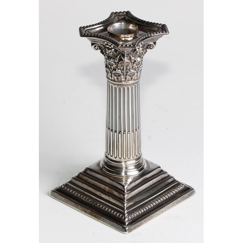 1035 - A pair of Victorian silver Corinthian column candlesticks, stepped square bases, 15.5cm high, London... 