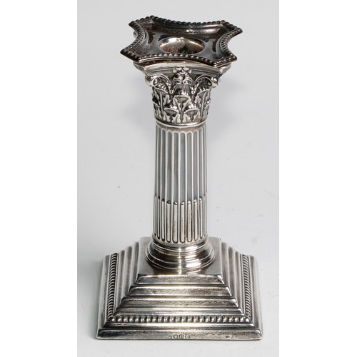 1035 - A pair of Victorian silver Corinthian column candlesticks, stepped square bases, 15.5cm high, London... 