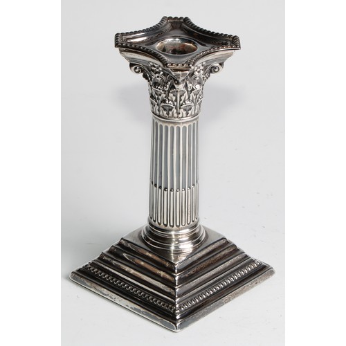 1035 - A pair of Victorian silver Corinthian column candlesticks, stepped square bases, 15.5cm high, London... 