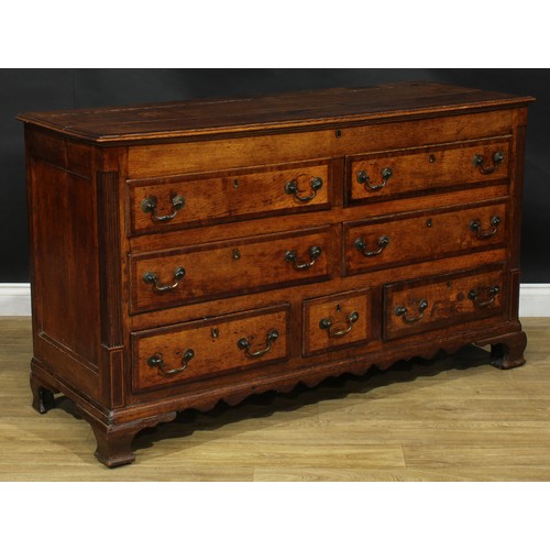 1795 - A George III mahogany crossbanded oak Lancashire chest, hinged top above four blind and three short ... 