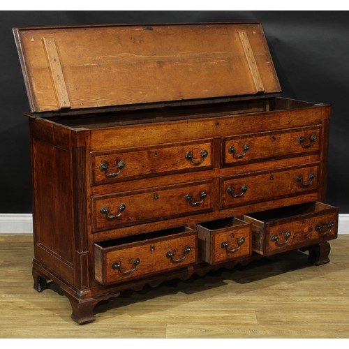 1795 - A George III mahogany crossbanded oak Lancashire chest, hinged top above four blind and three short ... 