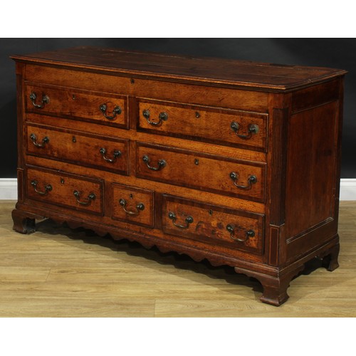 1795 - A George III mahogany crossbanded oak Lancashire chest, hinged top above four blind and three short ... 