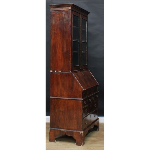 1728 - A George I/II walnut bureau bookcase, moulded cornice above a pair of glazed doors and candle slides... 