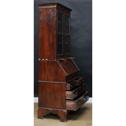 1728 - A George I/II walnut bureau bookcase, moulded cornice above a pair of glazed doors and candle slides... 