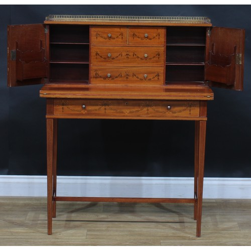 1980 - A pair of Sheraton Revival mahogany and marquetry bonheurs du jour, each with a shallow brass three-... 