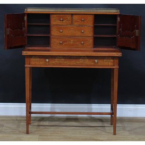 1980 - A pair of Sheraton Revival mahogany and marquetry bonheurs du jour, each with a shallow brass three-... 