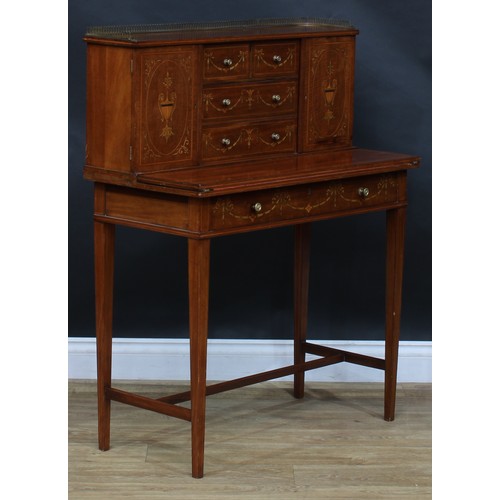 1980 - A pair of Sheraton Revival mahogany and marquetry bonheurs du jour, each with a shallow brass three-... 