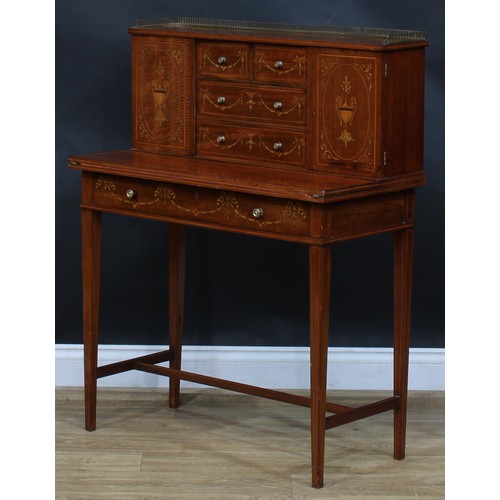 1980 - A pair of Sheraton Revival mahogany and marquetry bonheurs du jour, each with a shallow brass three-... 