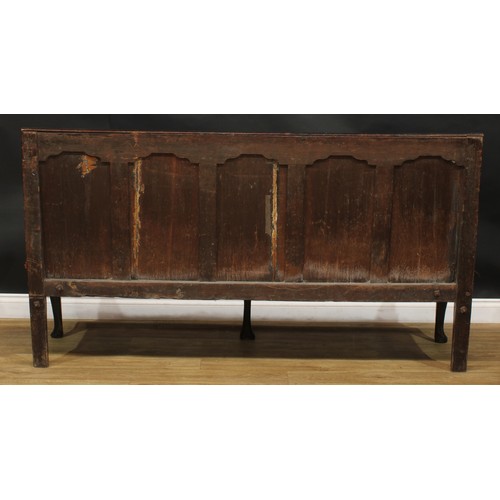 2007 - An 18th century oak settle, rectangular back with five arched raised and fielded panels, shaped arms... 