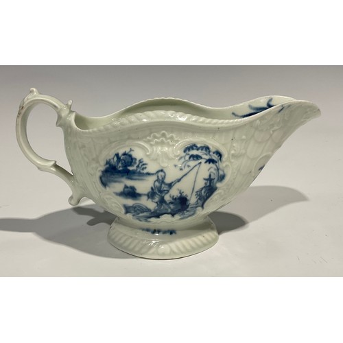 179 - A first period Worcester blue and white sauceboat, the whole press moulded and painted with Chinese ... 