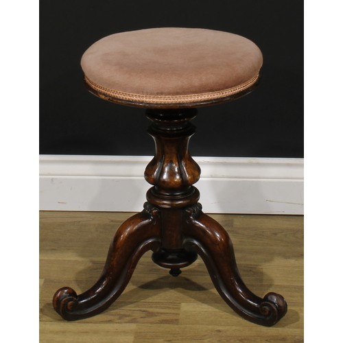 2279 - A Victorian walnut adjustable piano stool, stuffed over seat, rising on a lobed baluster column, thr... 