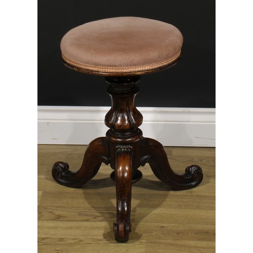 2279 - A Victorian walnut adjustable piano stool, stuffed over seat, rising on a lobed baluster column, thr... 