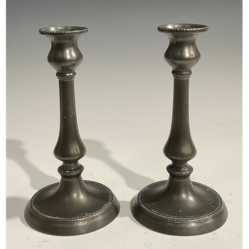 1810 - A pair of 18th century oval pewter plates, quite plain, broad rims, London touch marks, 35.5cm wide,... 