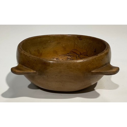 2744 - Treen - a 19th century lugged circular sycamore bowl, 20cm in diameter; a 19th century circular turn... 