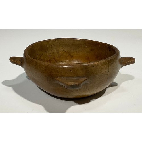 2744 - Treen - a 19th century lugged circular sycamore bowl, 20cm in diameter; a 19th century circular turn... 