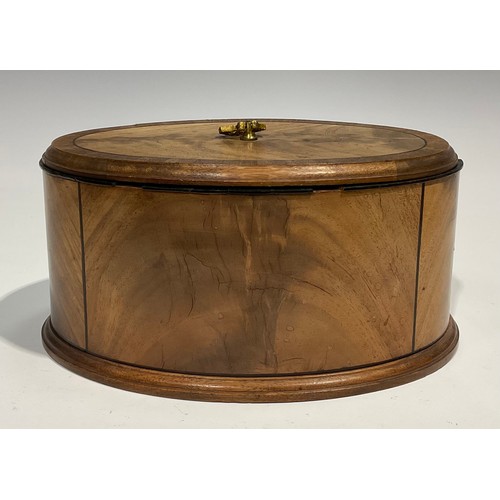 1805 - A late 19th century oval mahogany box and cover, crossbanded and outlined with ebony stringing, moul... 