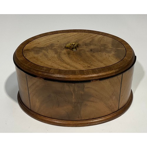 1805 - A late 19th century oval mahogany box and cover, crossbanded and outlined with ebony stringing, moul... 