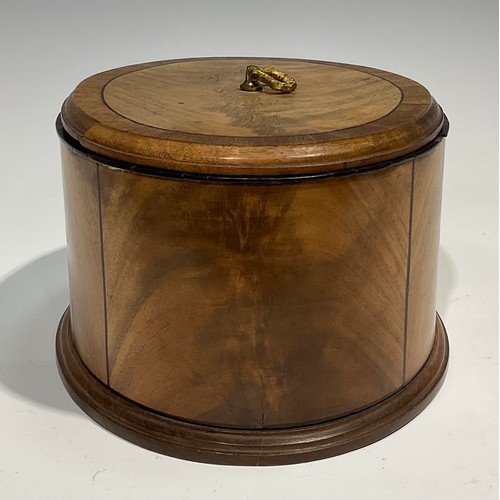 1805 - A late 19th century oval mahogany box and cover, crossbanded and outlined with ebony stringing, moul... 