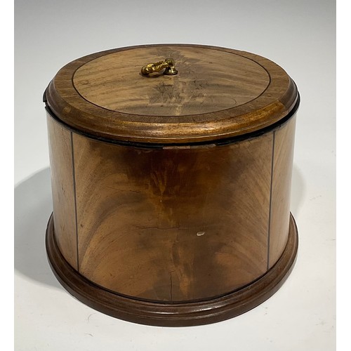 1805 - A late 19th century oval mahogany box and cover, crossbanded and outlined with ebony stringing, moul... 