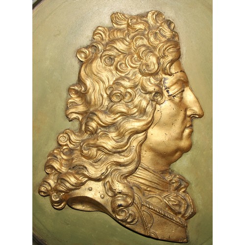 599 - Interior design - large gilt cameo oval framed wall hanging portrait bust of louis XIV, against a sh... 