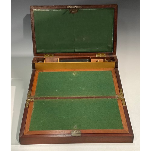 1685 - A George IV brass bound mahogany campaign writing box, hinged cover enclosing an arrangement of comp... 