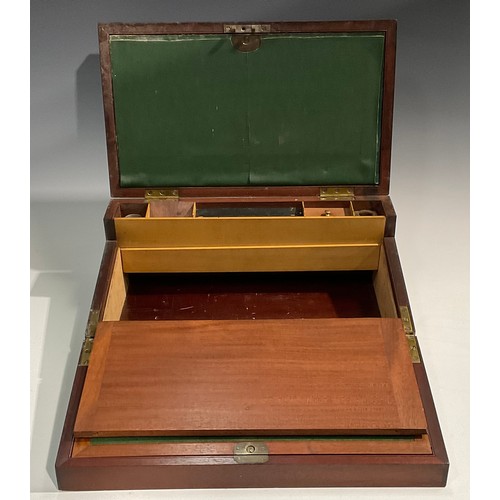 1685 - A George IV brass bound mahogany campaign writing box, hinged cover enclosing an arrangement of comp... 