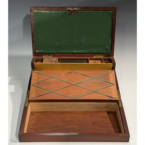 1685 - A George IV brass bound mahogany campaign writing box, hinged cover enclosing an arrangement of comp... 