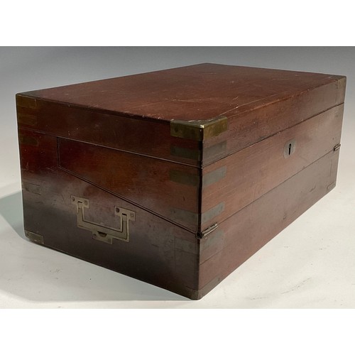 1685 - A George IV brass bound mahogany campaign writing box, hinged cover enclosing an arrangement of comp... 